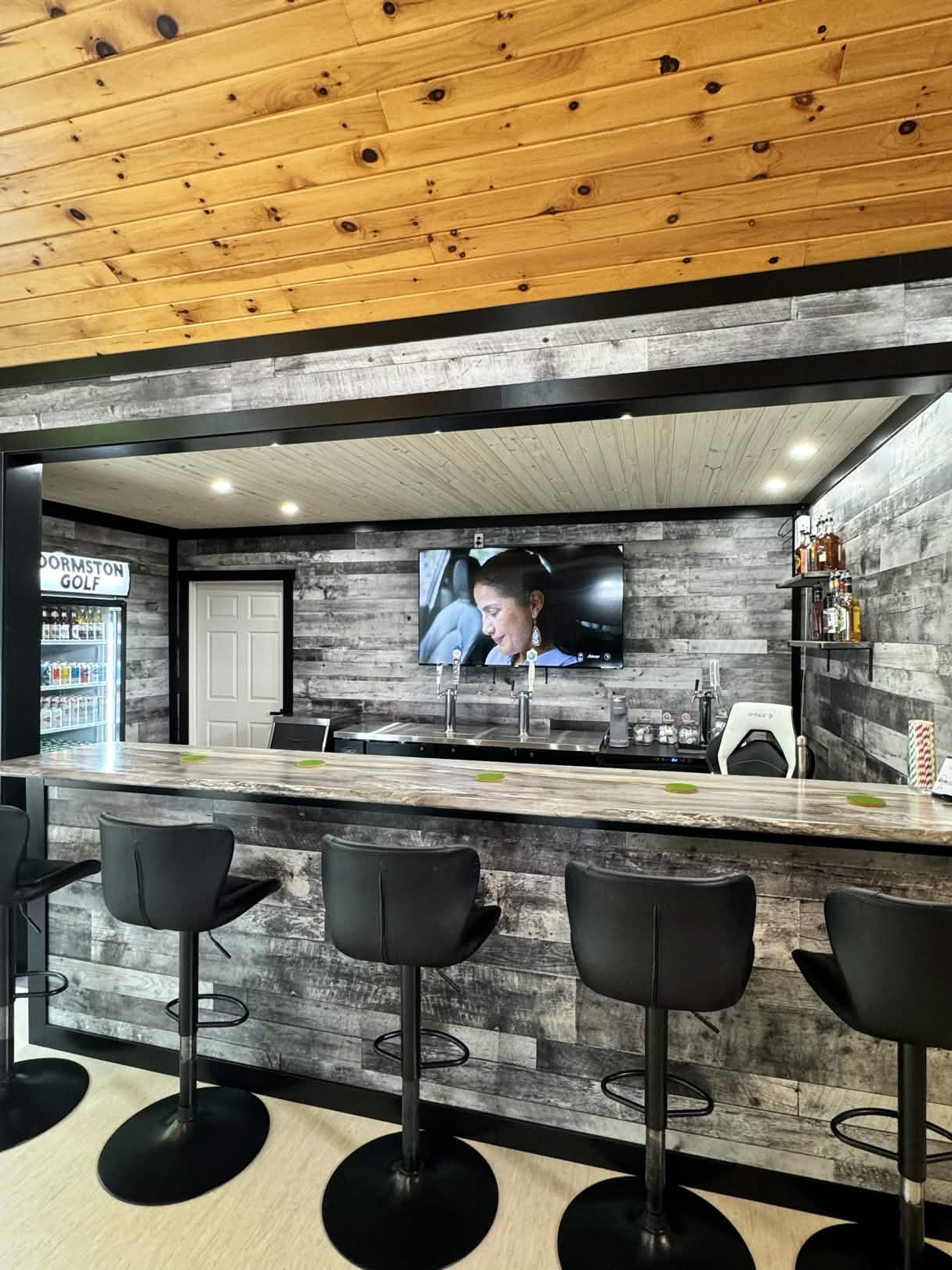 Golfers watching sim